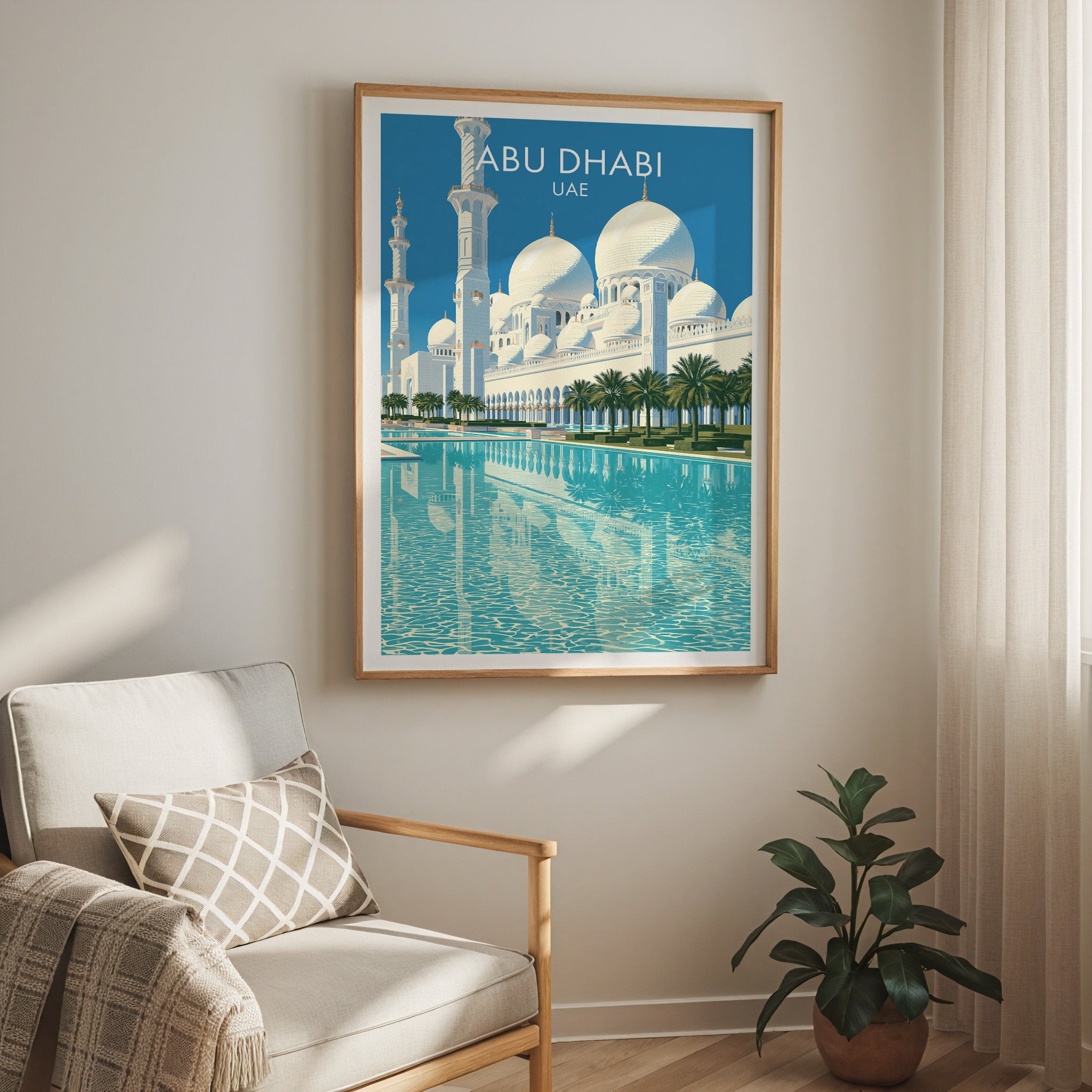 Sheikh Zayed Mosque Abu Dhabi travel print in a light oak frame on a living room wall beside a linen armchair