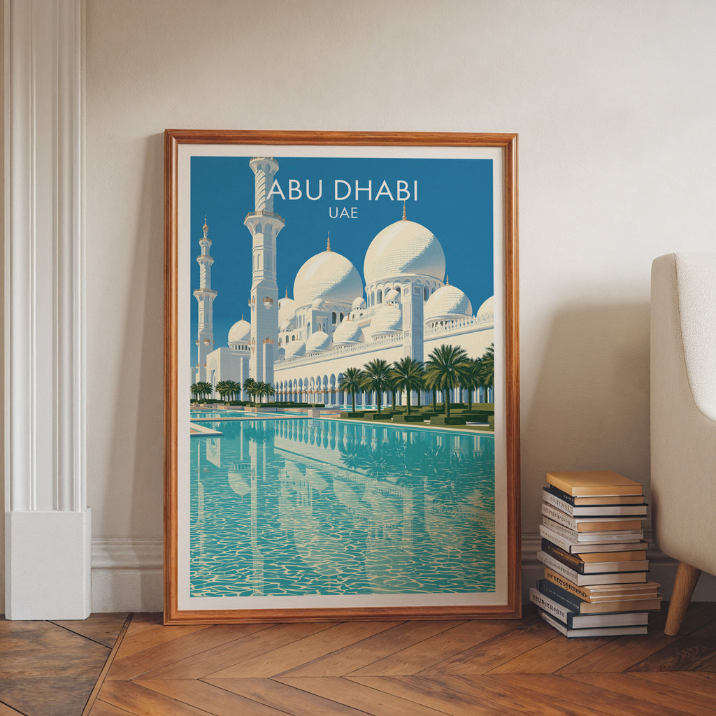Sheikh Zayed Mosque Abu Dhabi art print in a walnut frame leaning in a hallway beside stacked books