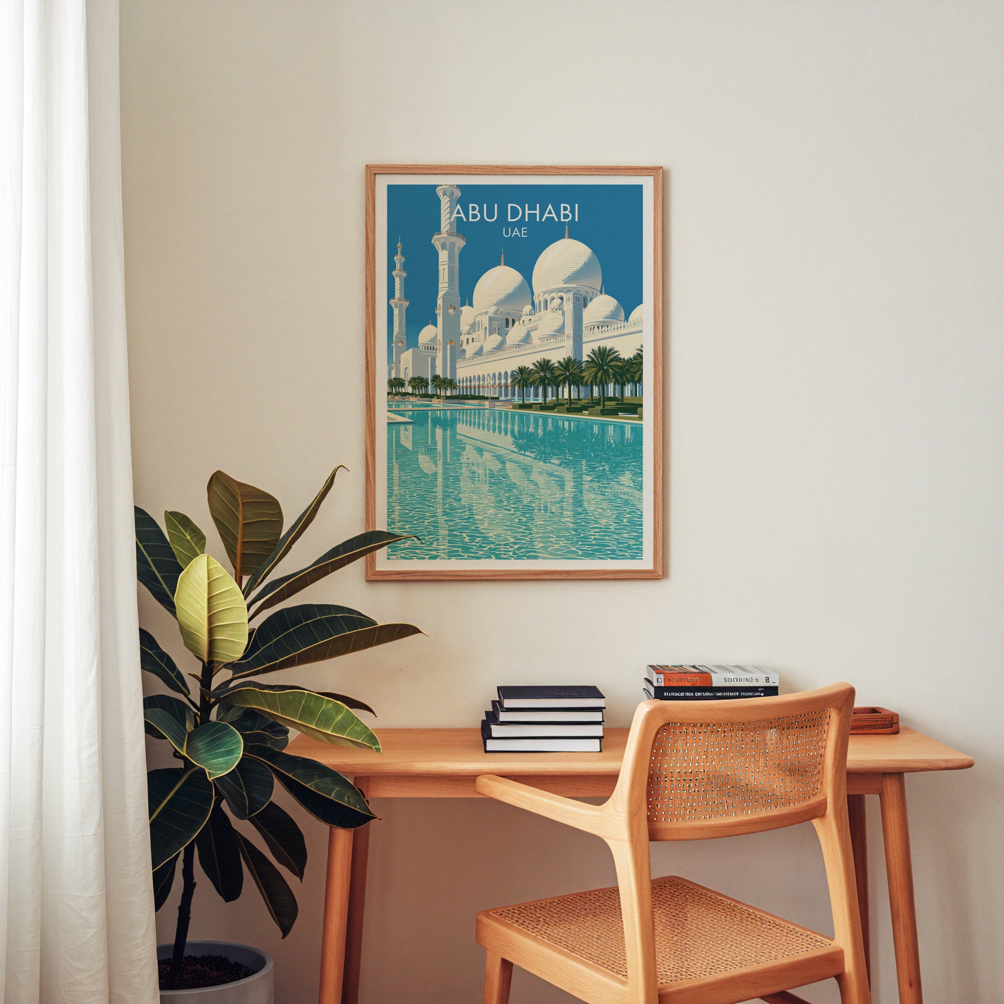 Sheikh Zayed Mosque Abu Dhabi wall art above a wooden home office desk with a rattan chair and books