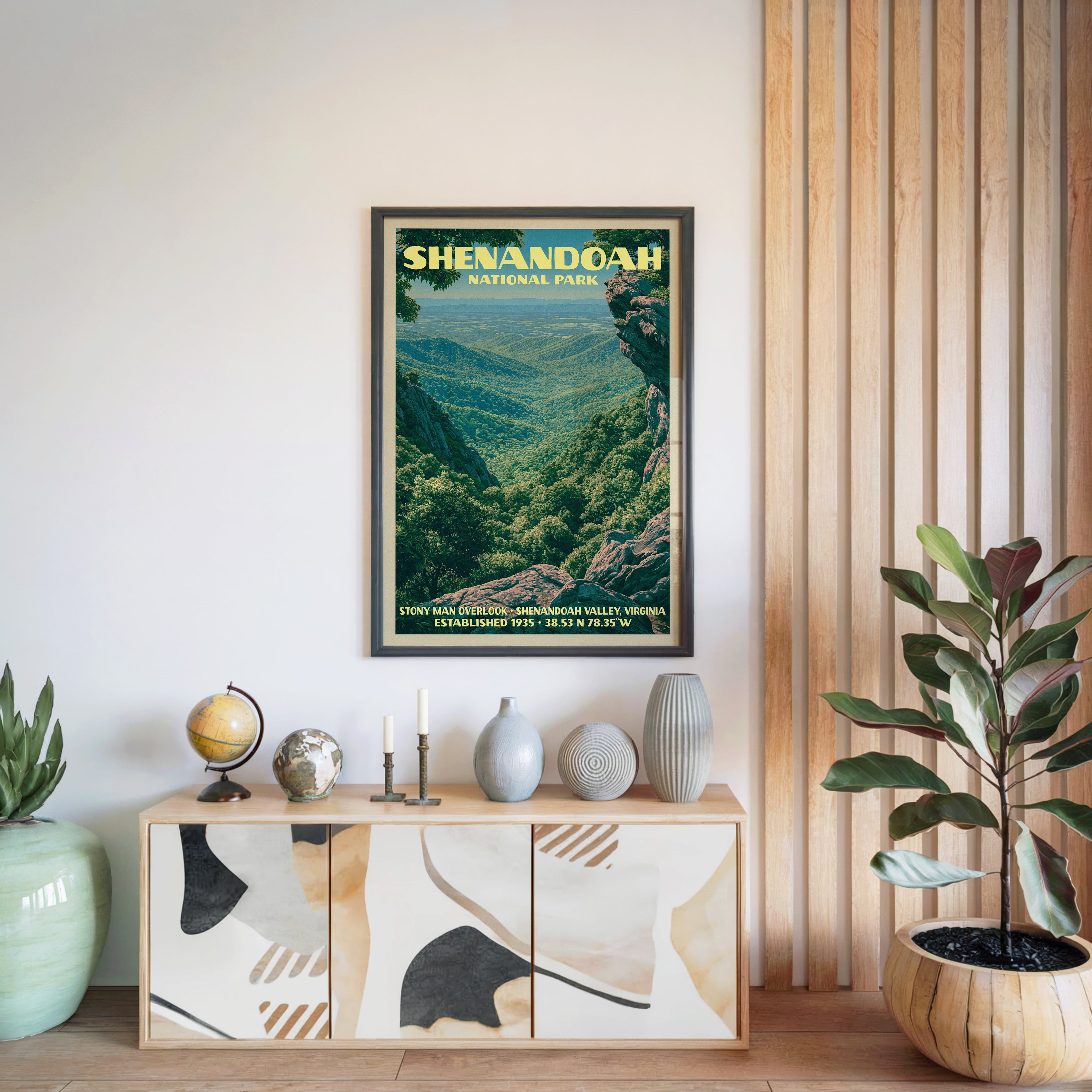 Shenandoah National Park print in a black frame above a light wood sideboard by a slatted wall panel