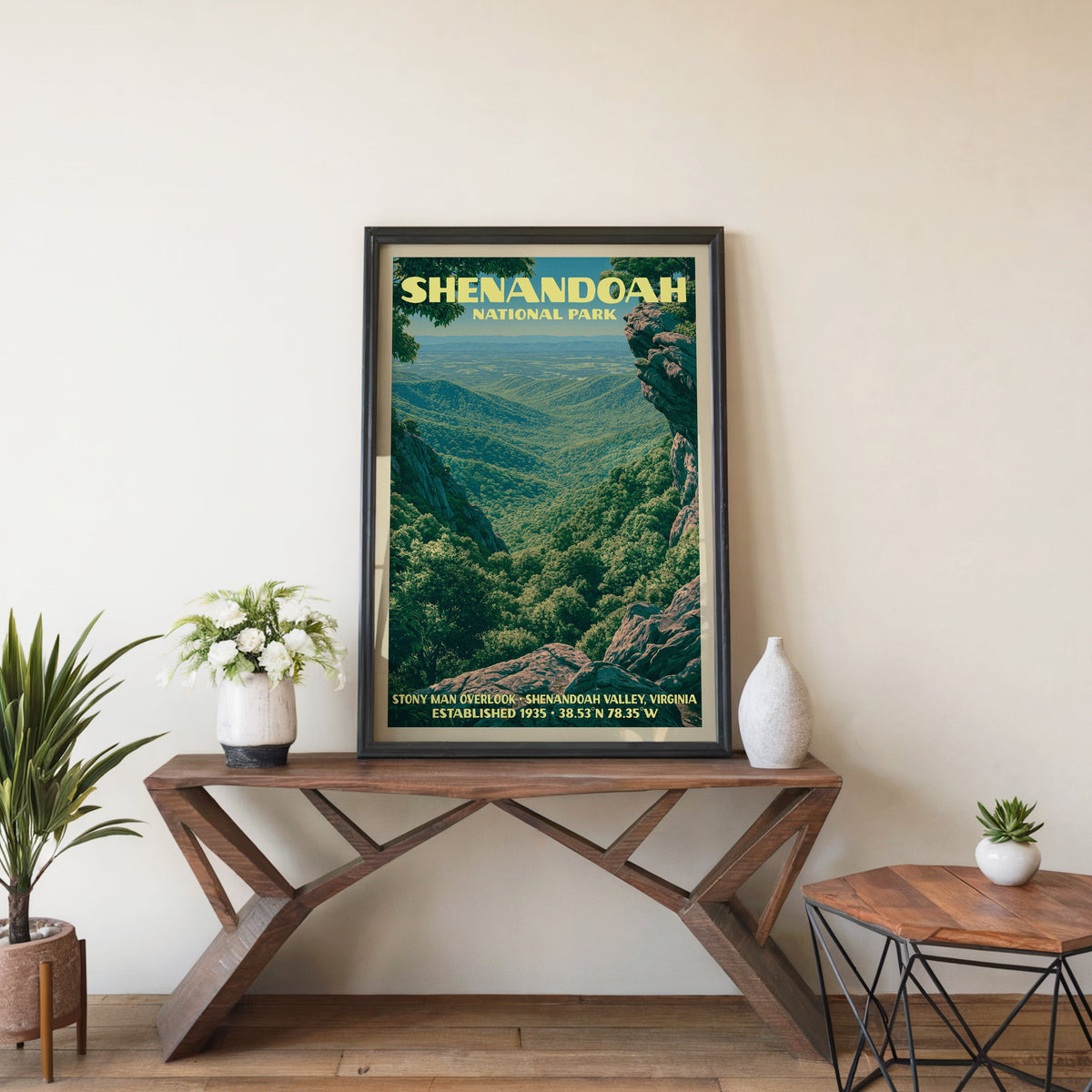 Shenandoah Stony Man wall art in black, leaning on a walnut console with white anemones and a vase