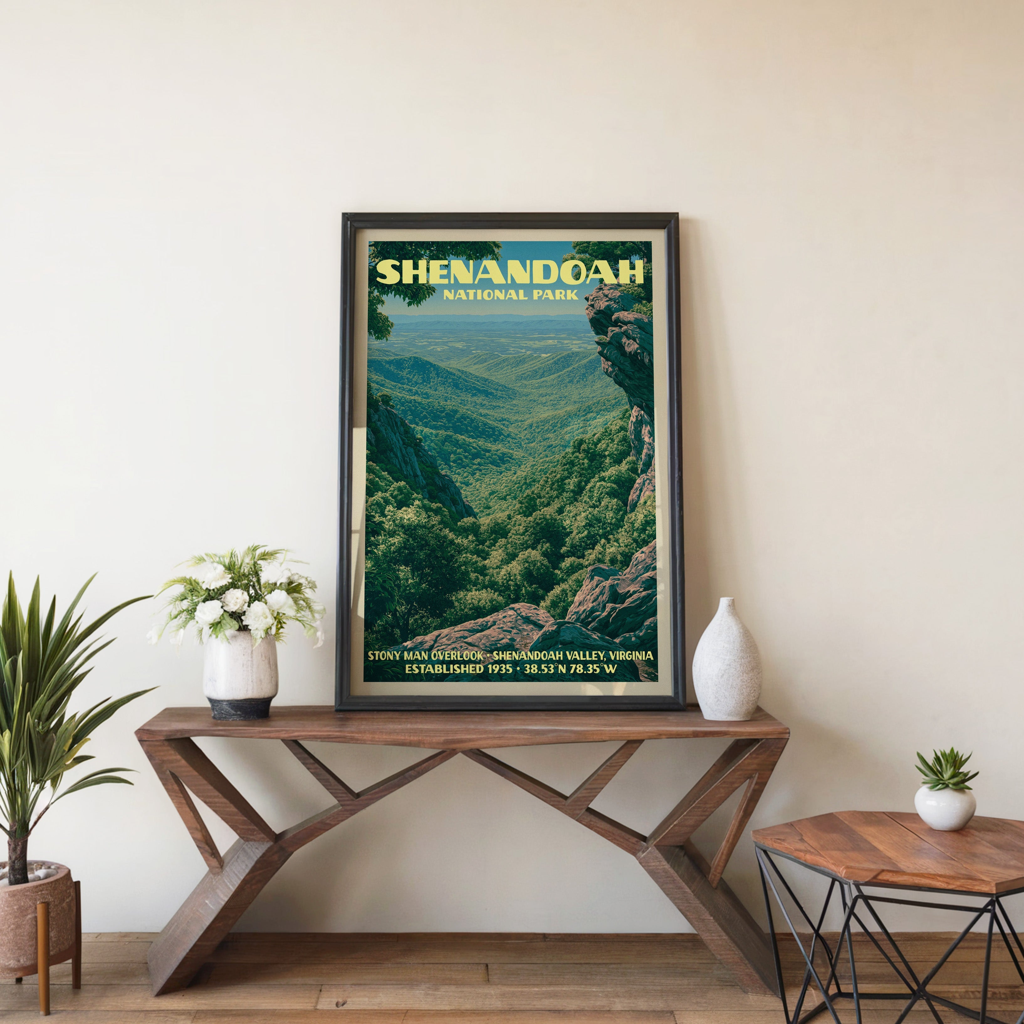 Shenandoah Stony Man wall art in black, leaning on a walnut console with white anemones and a vase