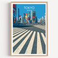 Shibuya Crossing Tokyo Japan travel poster in a natural wood frame, shown against a clean white wall