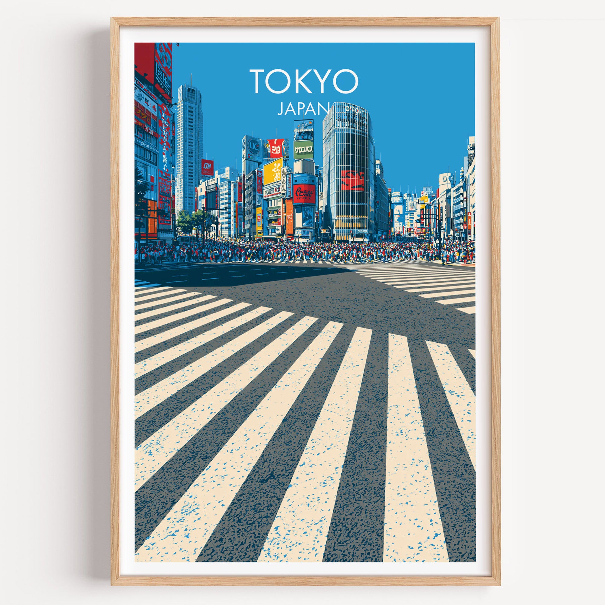 Shibuya Crossing Tokyo Japan travel poster in a natural wood frame, shown against a clean white wall