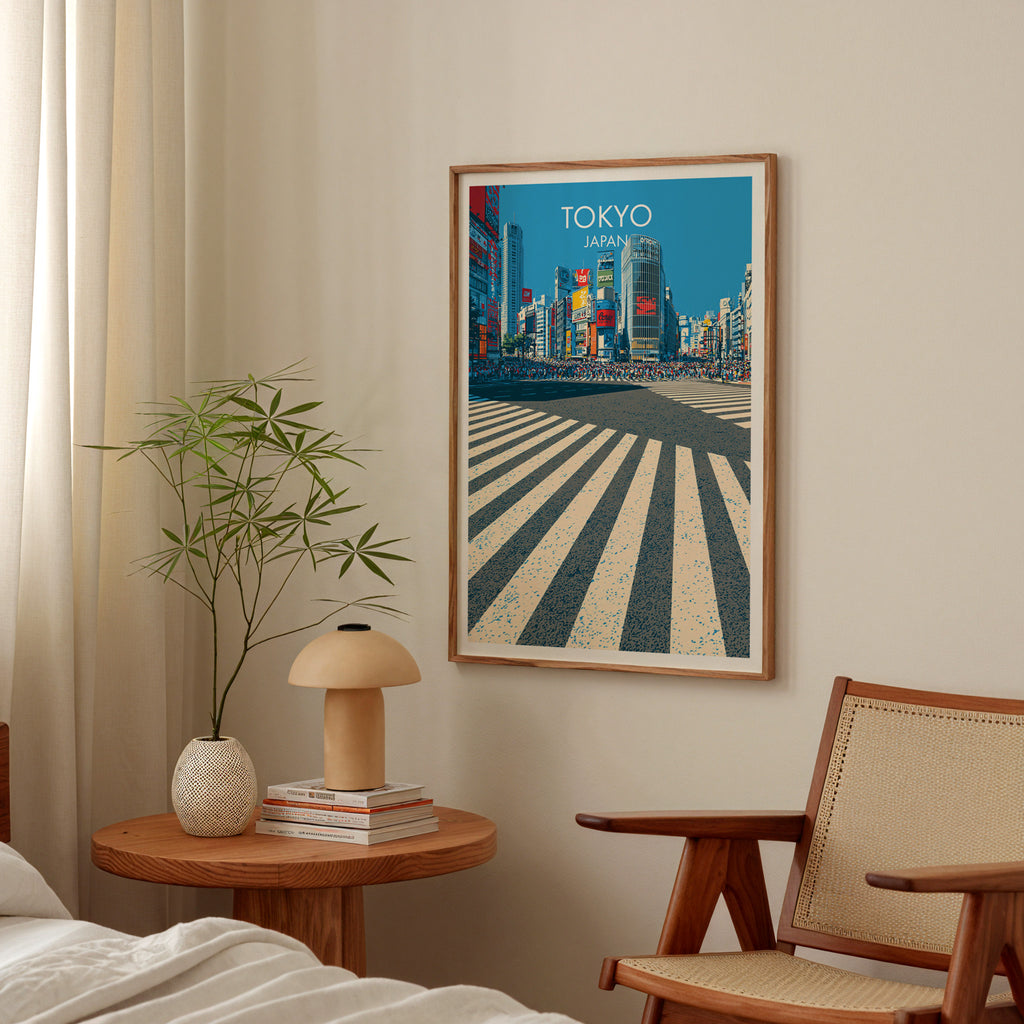 Shibuya Crossing Tokyo Japan poster above a bedroom nightstand with a bamboo plant and mushroom lamp