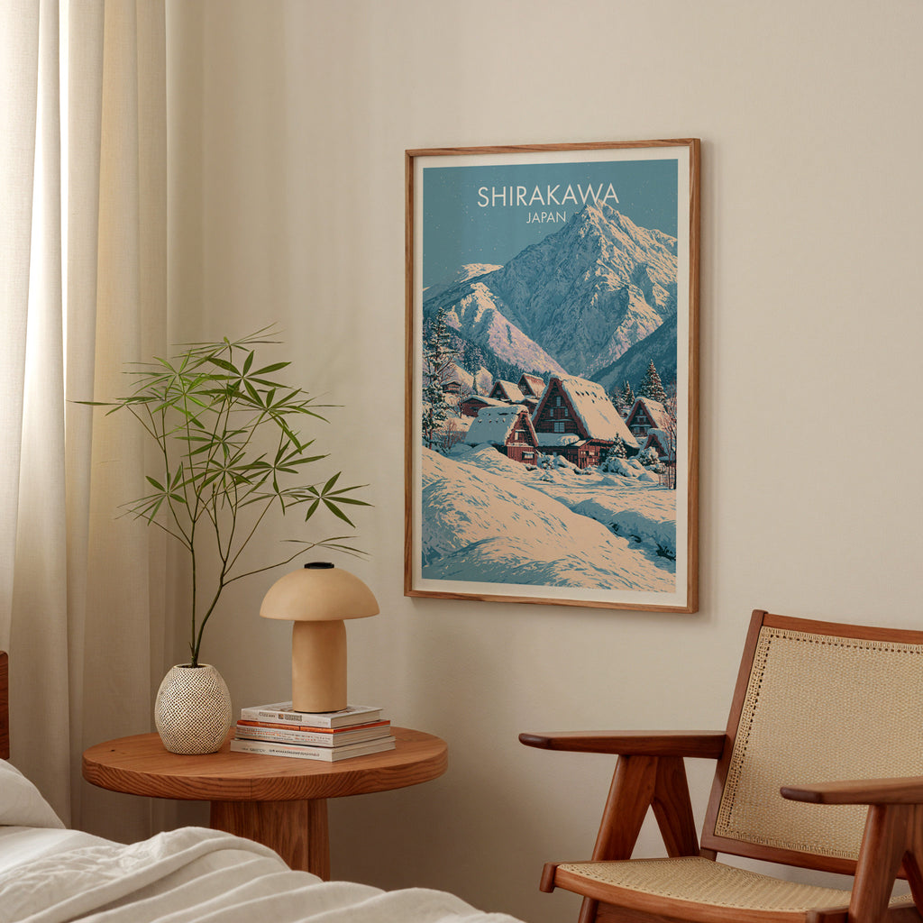 Shirakawa go Japan poster above a bedroom nightstand with a bamboo plant and mushroom lamp
