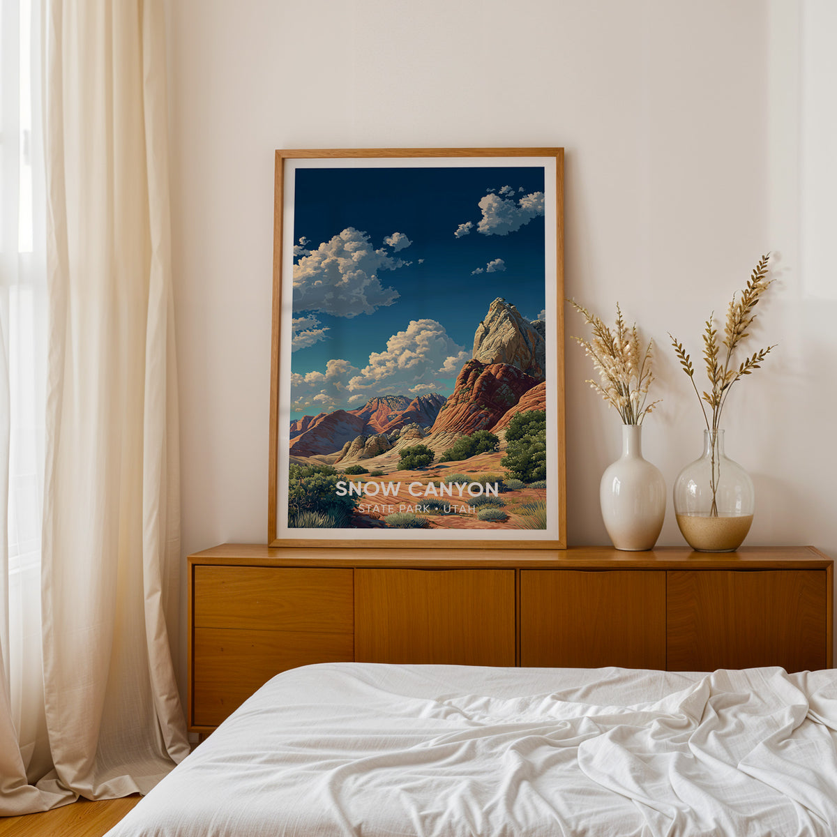 Utah sandstone print framed in oak on a teak bedside sideboard with dried pampas in a pair of white vases