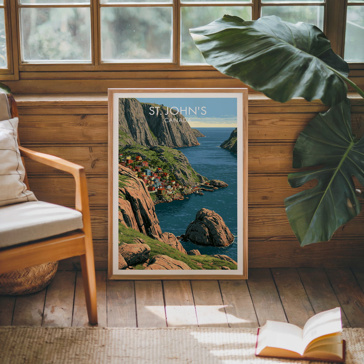 St John's Canada travel print in an oak frame against a pine cabin wall beside a monstera