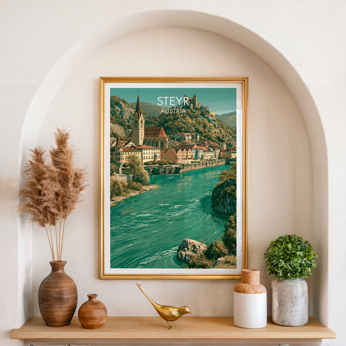 Steyr church spire poster, gold frame in an arched wall niche above pampas grass in a clay vase