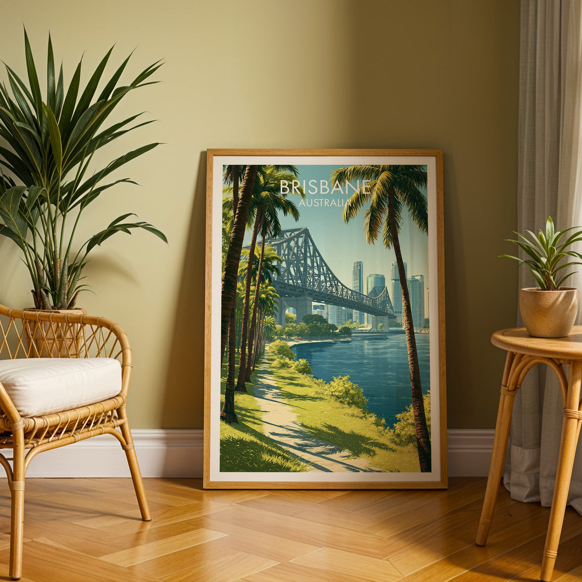 Story Bridge and palms print in an oak frame on herringbone parquet with a rattan chair and olive wall