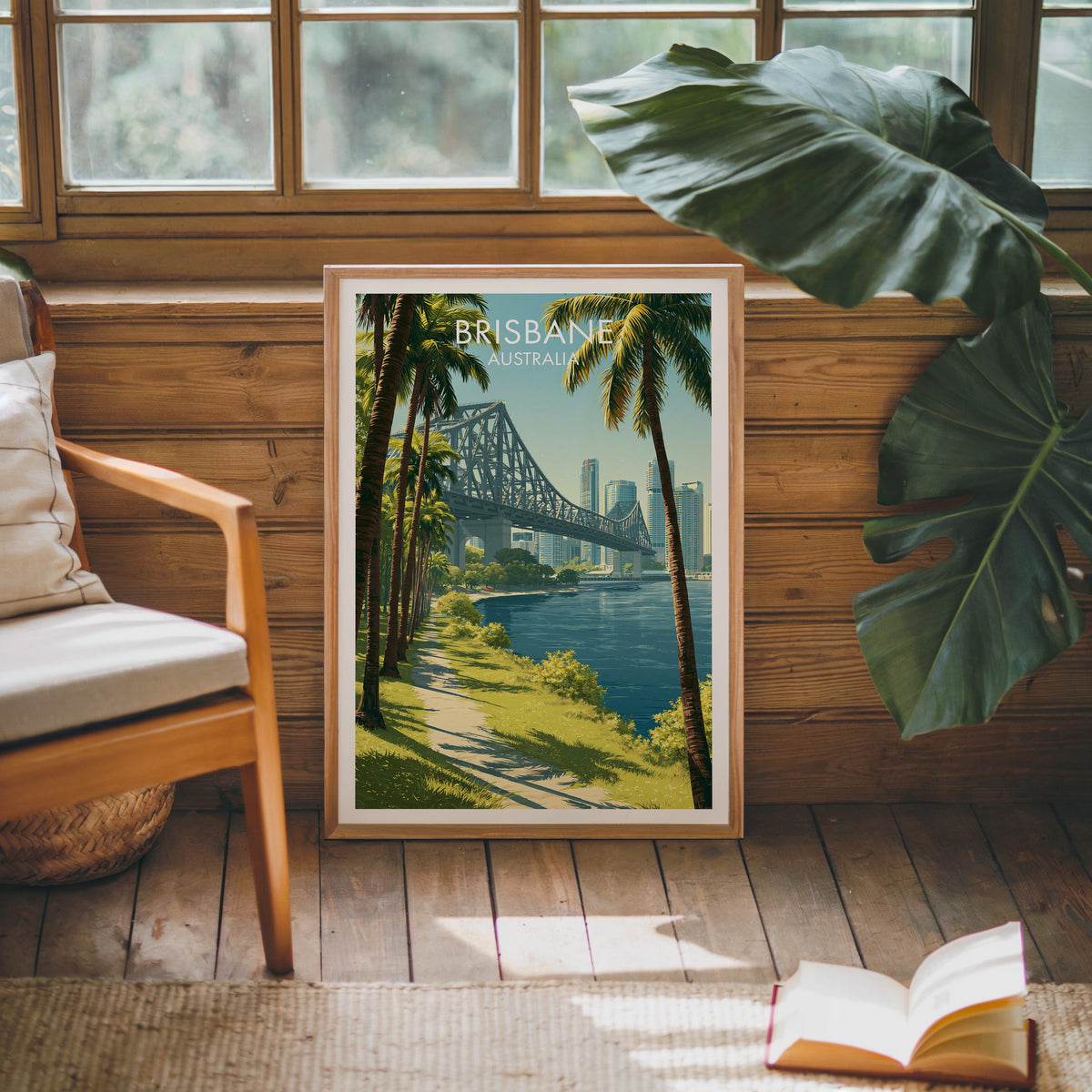 Brisbane River artwork in an oak frame against a pine cabin wall with a wooden armchair and jute rug