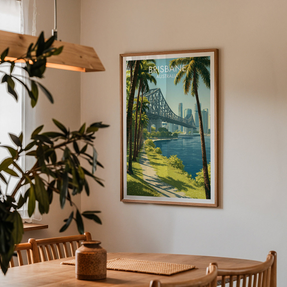 Story Bridge skyline print in an oak frame in a dining corner with oak table and a wood pendant light