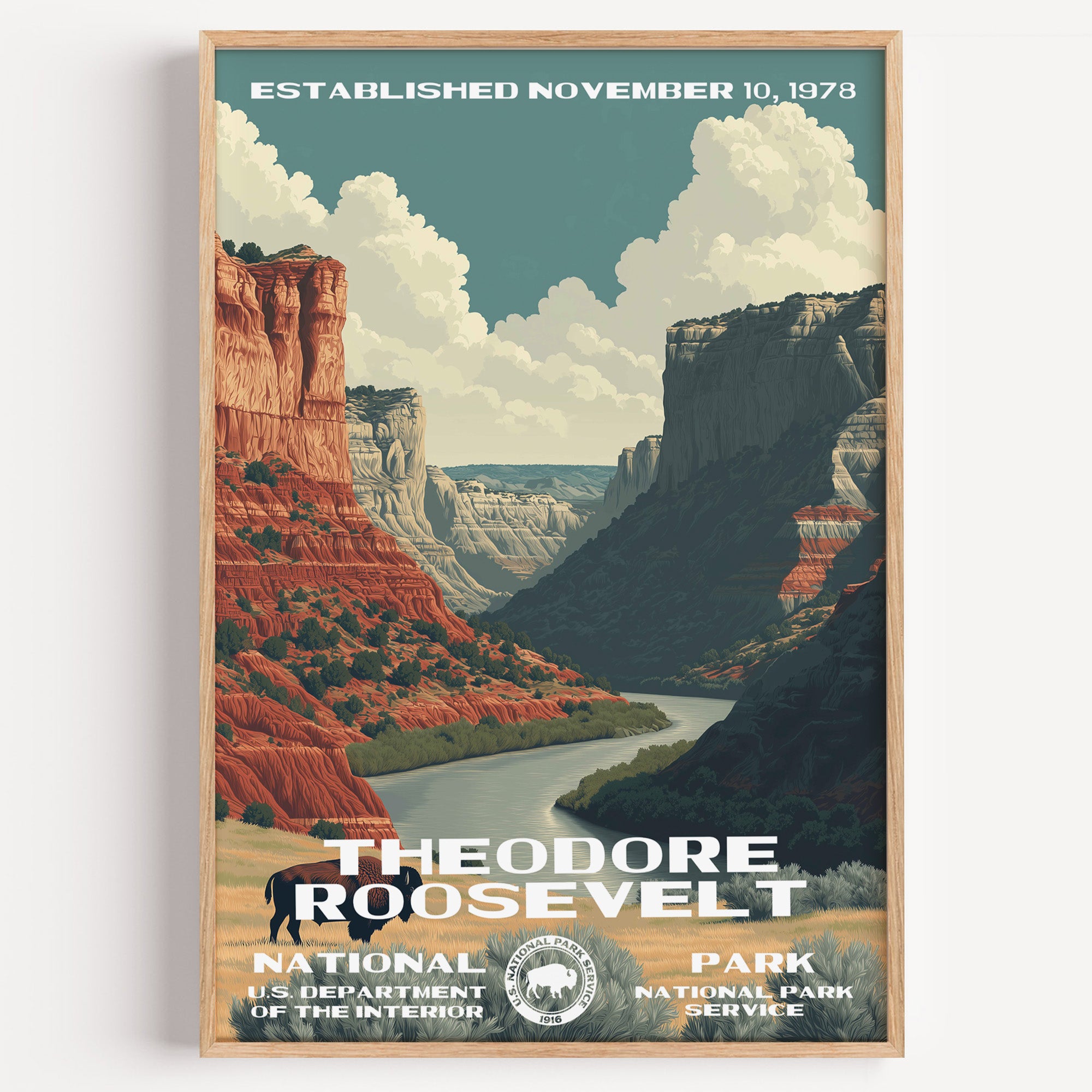Theodore Roosevelt National Park vintage travel poster in a wood frame, red badland cliffs above a bend in the Little