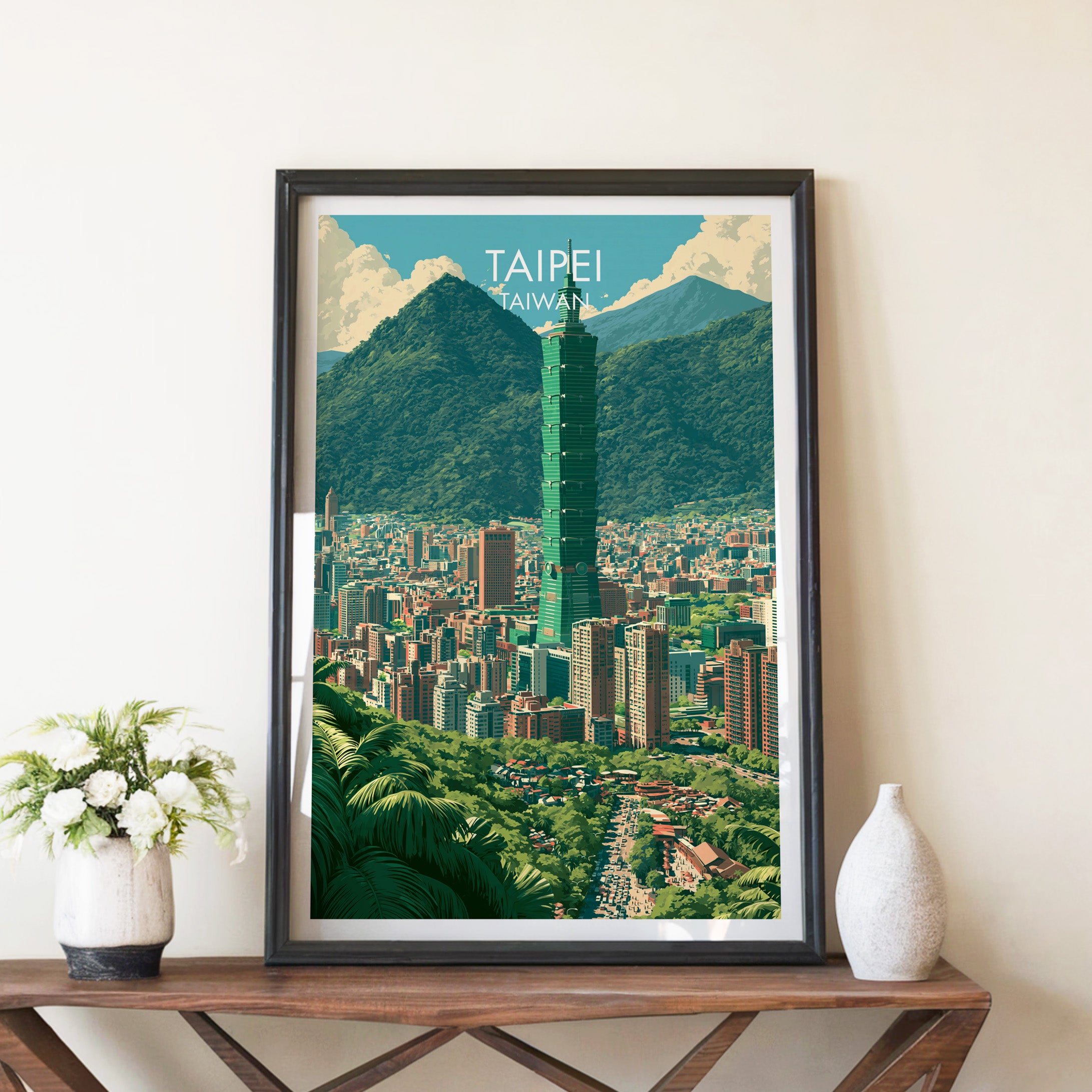 Taipei Taiwan travel poster in a black frame on a wooden console table with white flowers