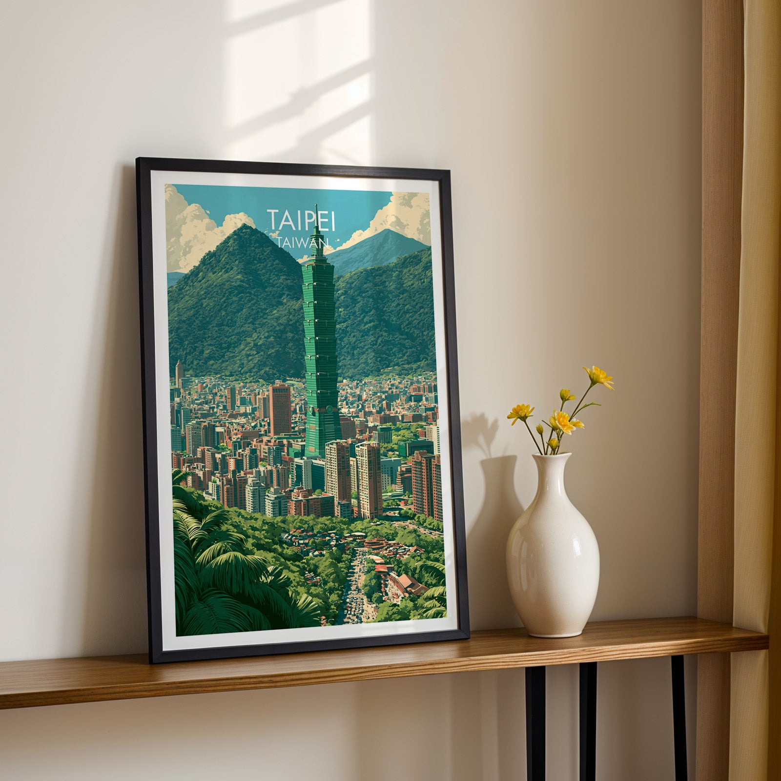 Black framed Taipei Taiwan print on a narrow hallway console in sunlight, styled with yellow flowers