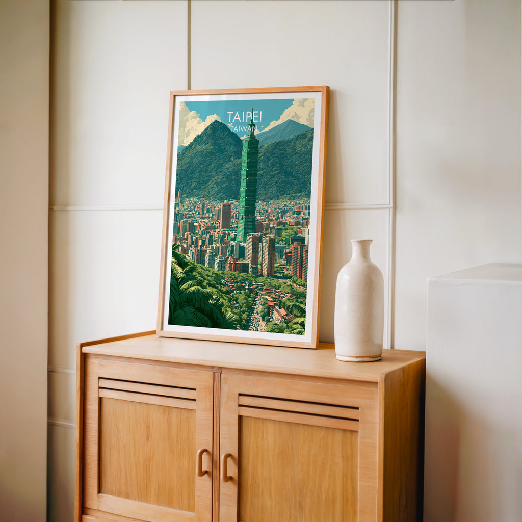 Small Taipei Taiwan travel poster in an oak frame on a mid-century sideboard with a ceramic vase