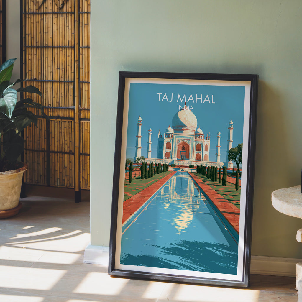 Taj Mahal Agra India wall art in a black frame leaning against a sage green wall beside a bamboo screen