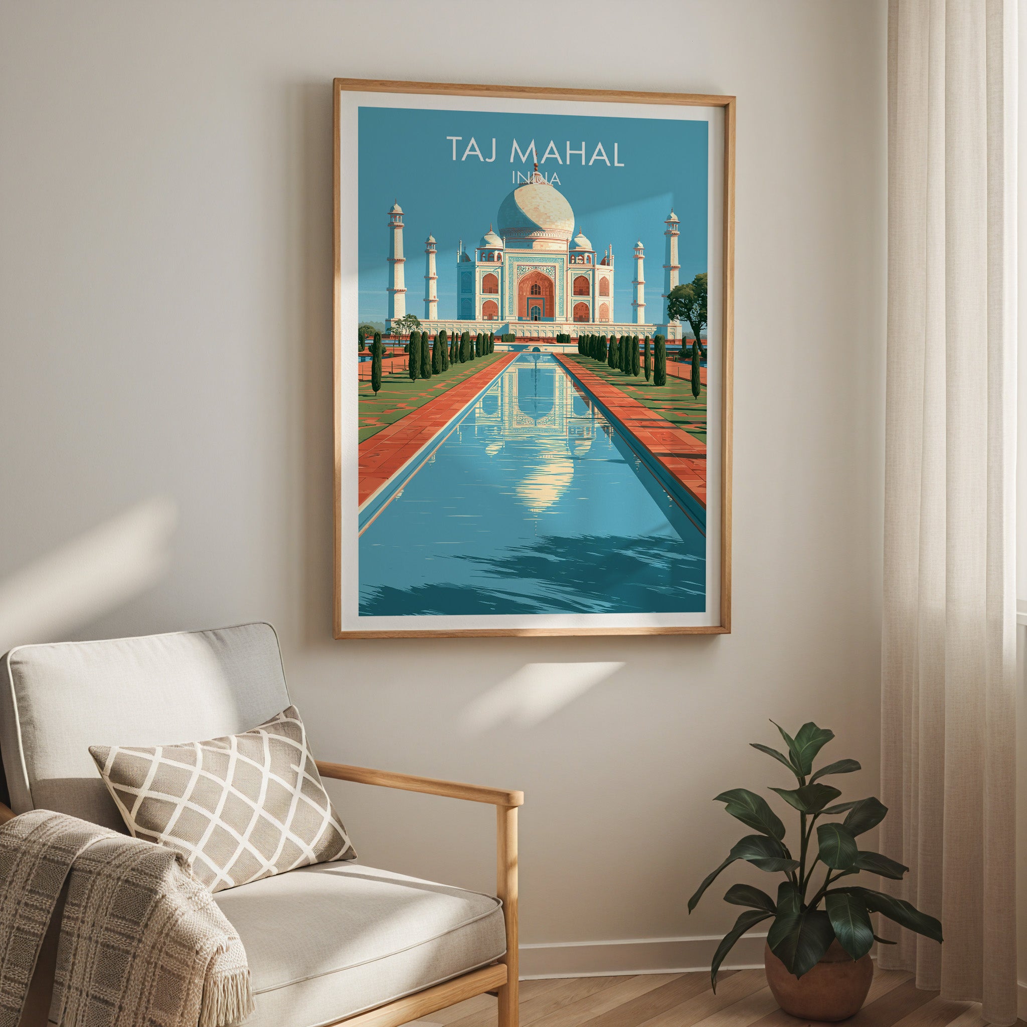 Taj Mahal Agra India travel print in a light oak frame on a living room wall beside a linen armchair