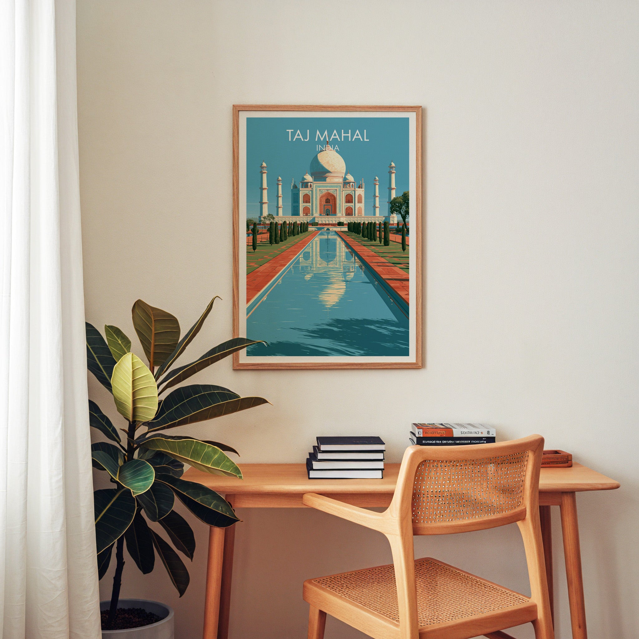 Taj Mahal Agra India wall art above a wooden home office desk with a rattan chair and books