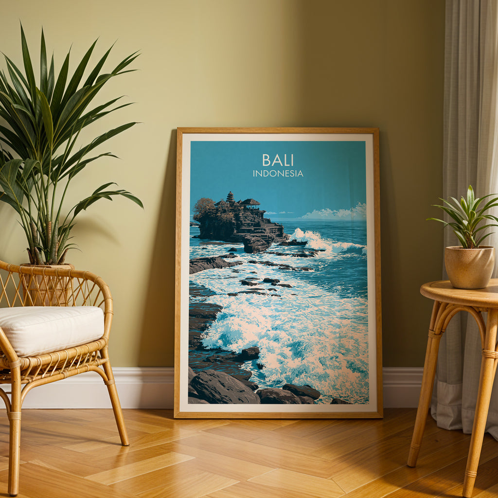 Large Tanah Lot Bali Indonesia travel print in an oak frame leaning on a herringbone floor next to a rattan chair