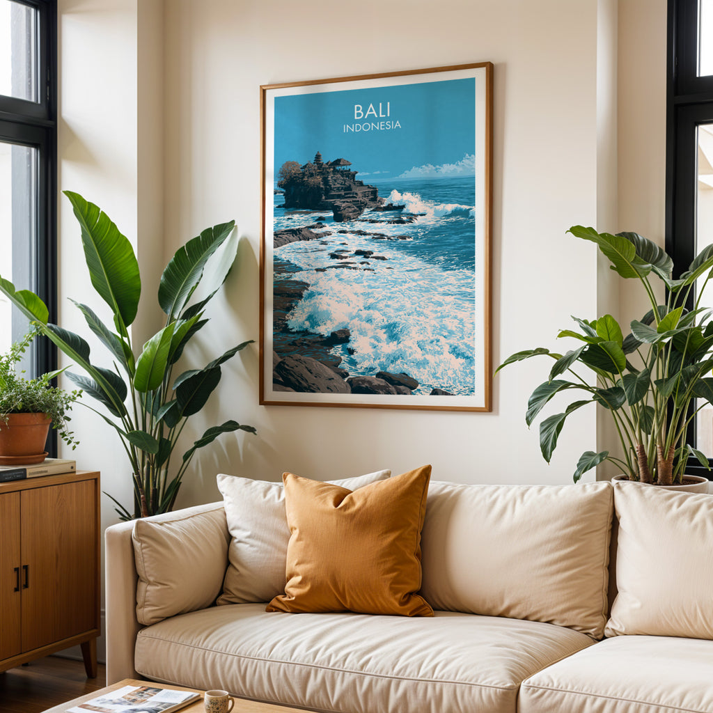 Framed Tanah Lot Bali Indonesia wall art hanging above a cream sofa in a bright living room with tropical plants