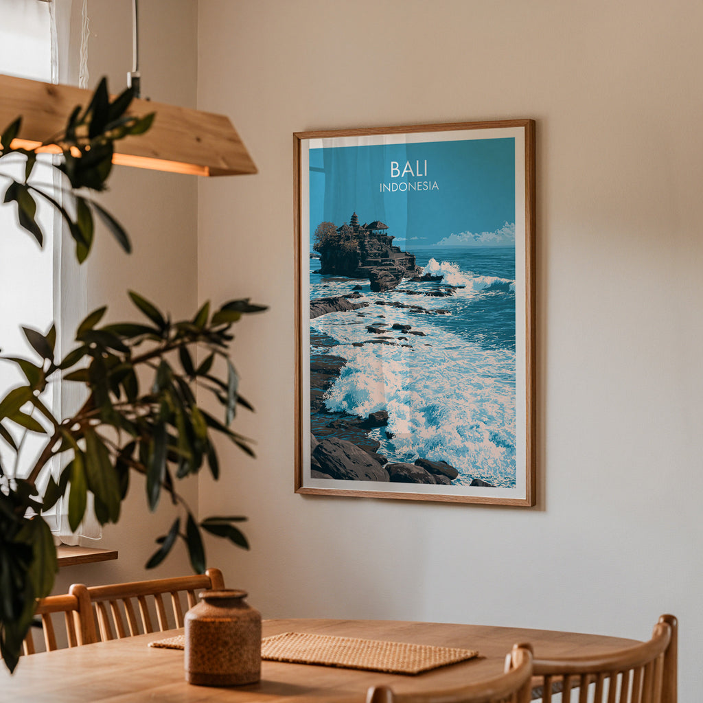 Framed Tanah Lot Bali Indonesia print on a dining room wall above an oak table in warm afternoon light