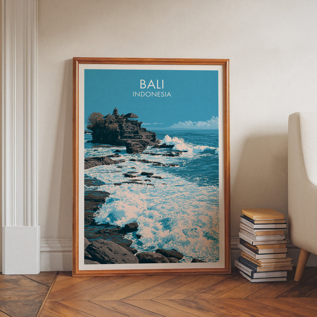 Tanah Lot Bali Indonesia art print in a walnut frame leaning in a hallway beside stacked books