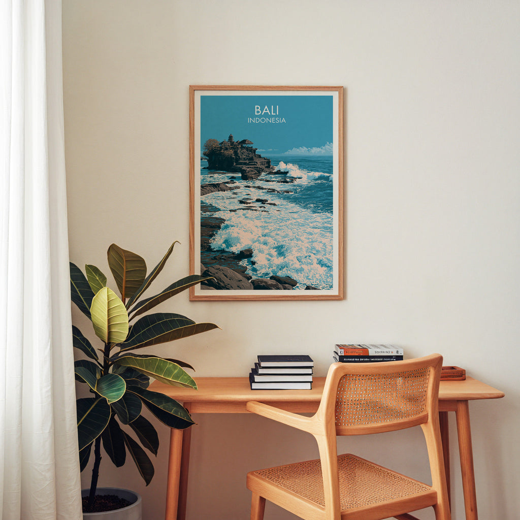 Tanah Lot Bali Indonesia wall art above a wooden home office desk with a rattan chair and books