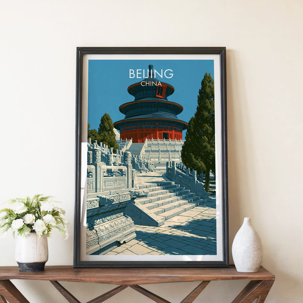 Temple of Heaven Beijing travel poster in a black frame on a wooden console table with white flowers