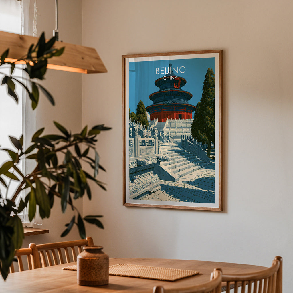 Framed Temple of Heaven Beijing print on a dining room wall above an oak table in warm afternoon light