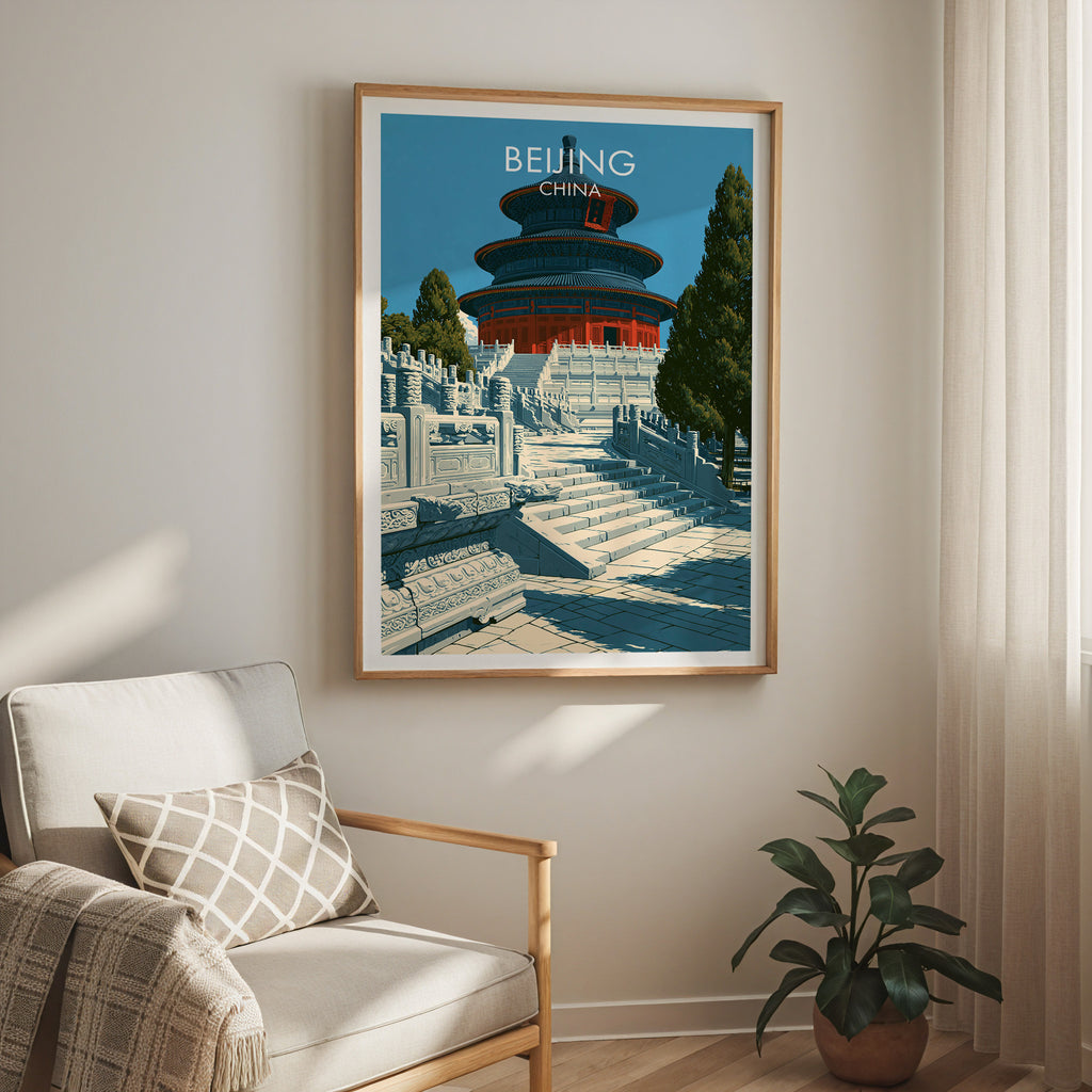 Temple of Heaven Beijing travel print in a light oak frame on a living room wall beside a linen armchair