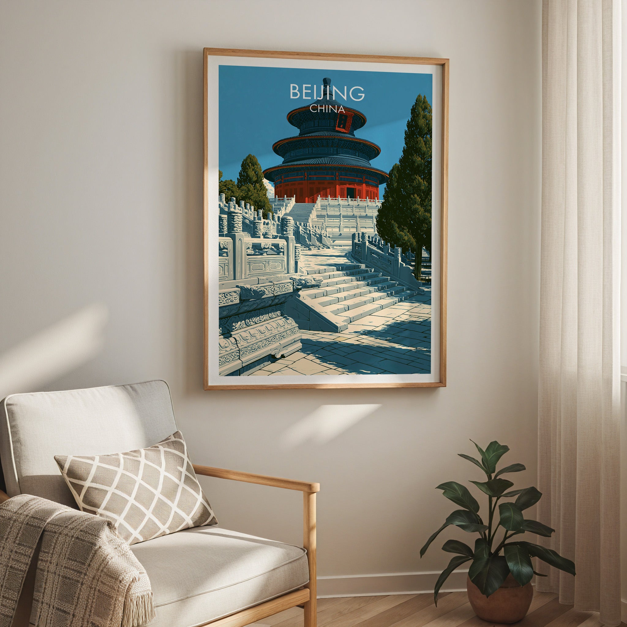 Temple of Heaven Beijing travel print in a light oak frame on a living room wall beside a linen armchair