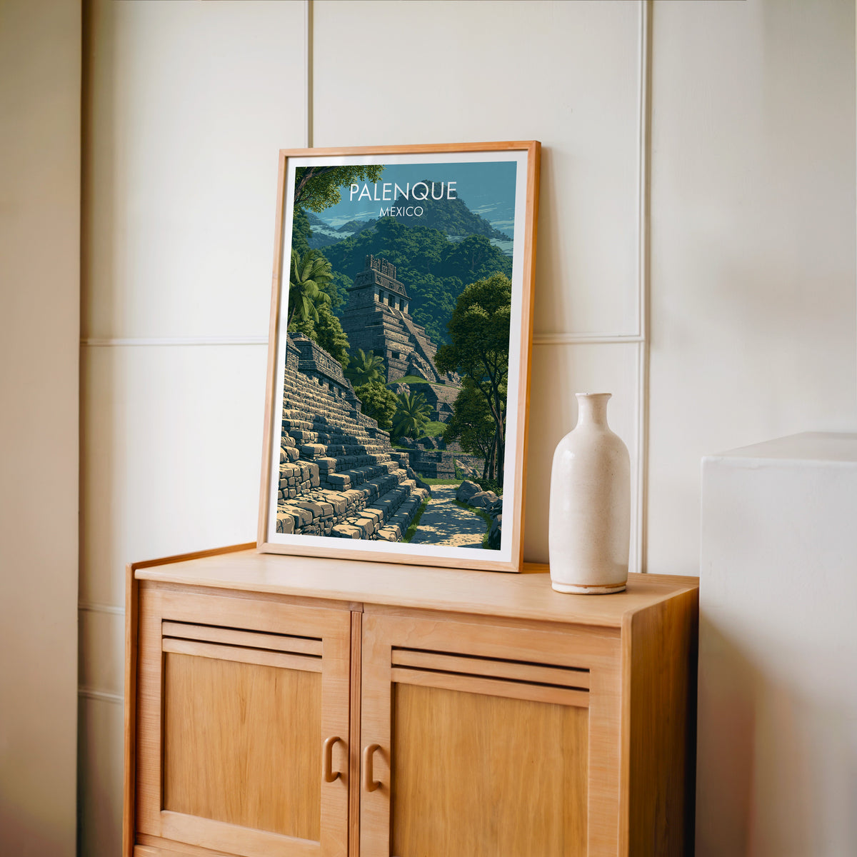 Carved roof crest and palms in an oak frame on a light oak cabinet against a cream panelled wall