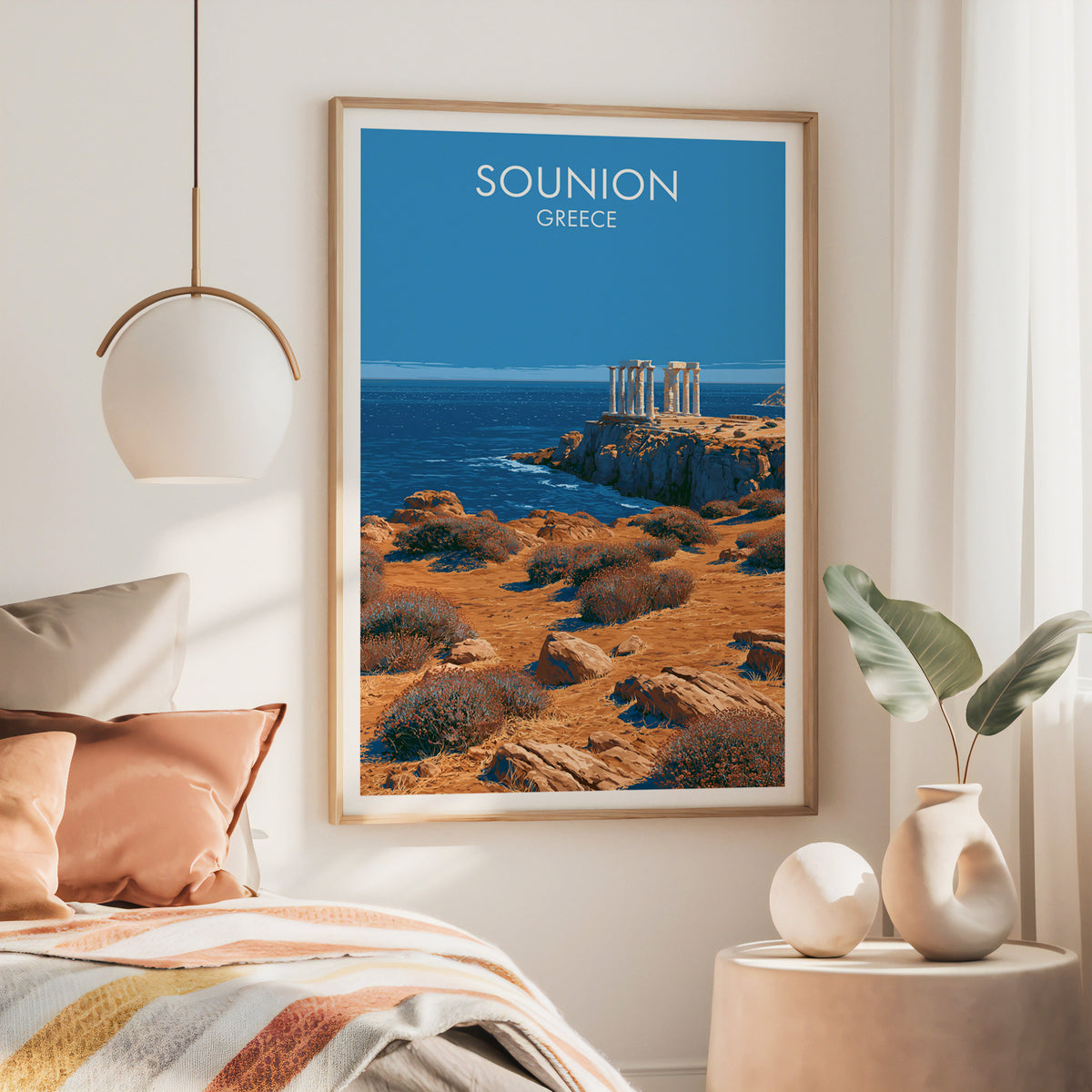 Temple of Poseidon wall art, large oak frame above a bed with rust bedding and a brass globe pendant