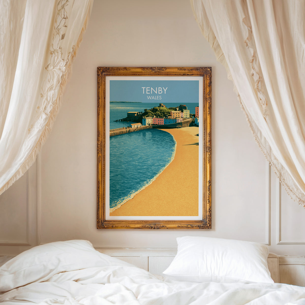 Tenby travel poster, ornate gold frame above a white bed with linen canopy curtains