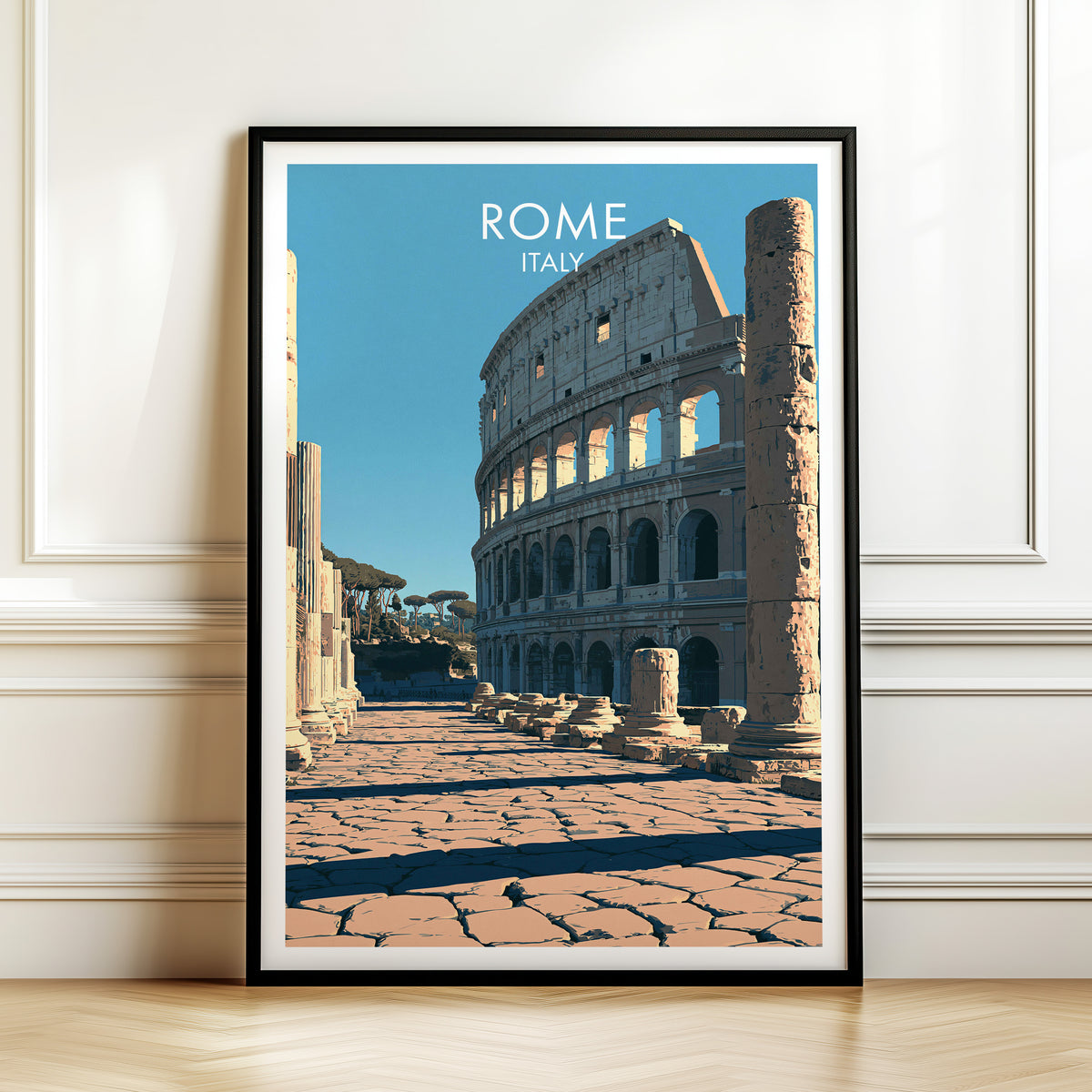 Rome Colosseum print, black frame leaning on a white panelled wall above a herringbone floor