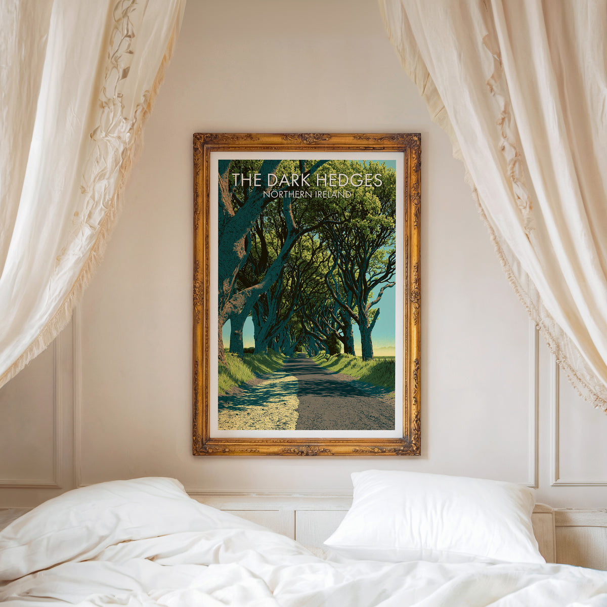 Dark Hedges travel poster, ornate gold frame above a white bed with linen canopy curtains