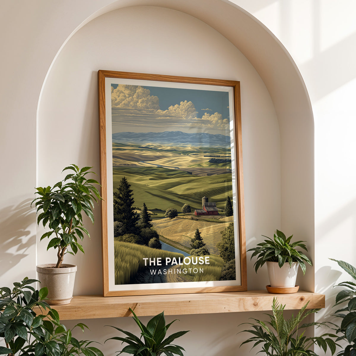 Palouse poster on a wood shelf set into a white arched alcove between two potted plants