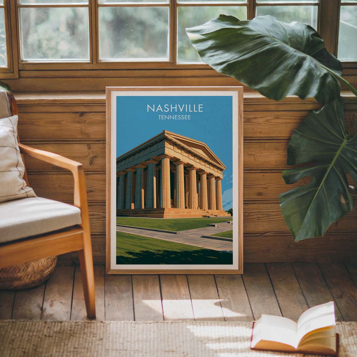 Nashville Parthenon print in oak on a sunlit wood-grain wall beside a mid-century armchair and open book.