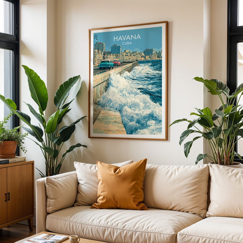 Malecon surf print in an oak frame above a cream sofa with a burnt-orange cushion and two tall tropical plants