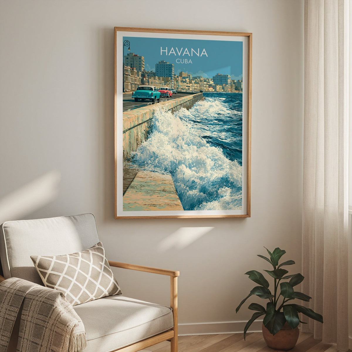 Havana seafront scene in an oak frame above a cream armchair with a check cushion, sheer curtain, rubber plant