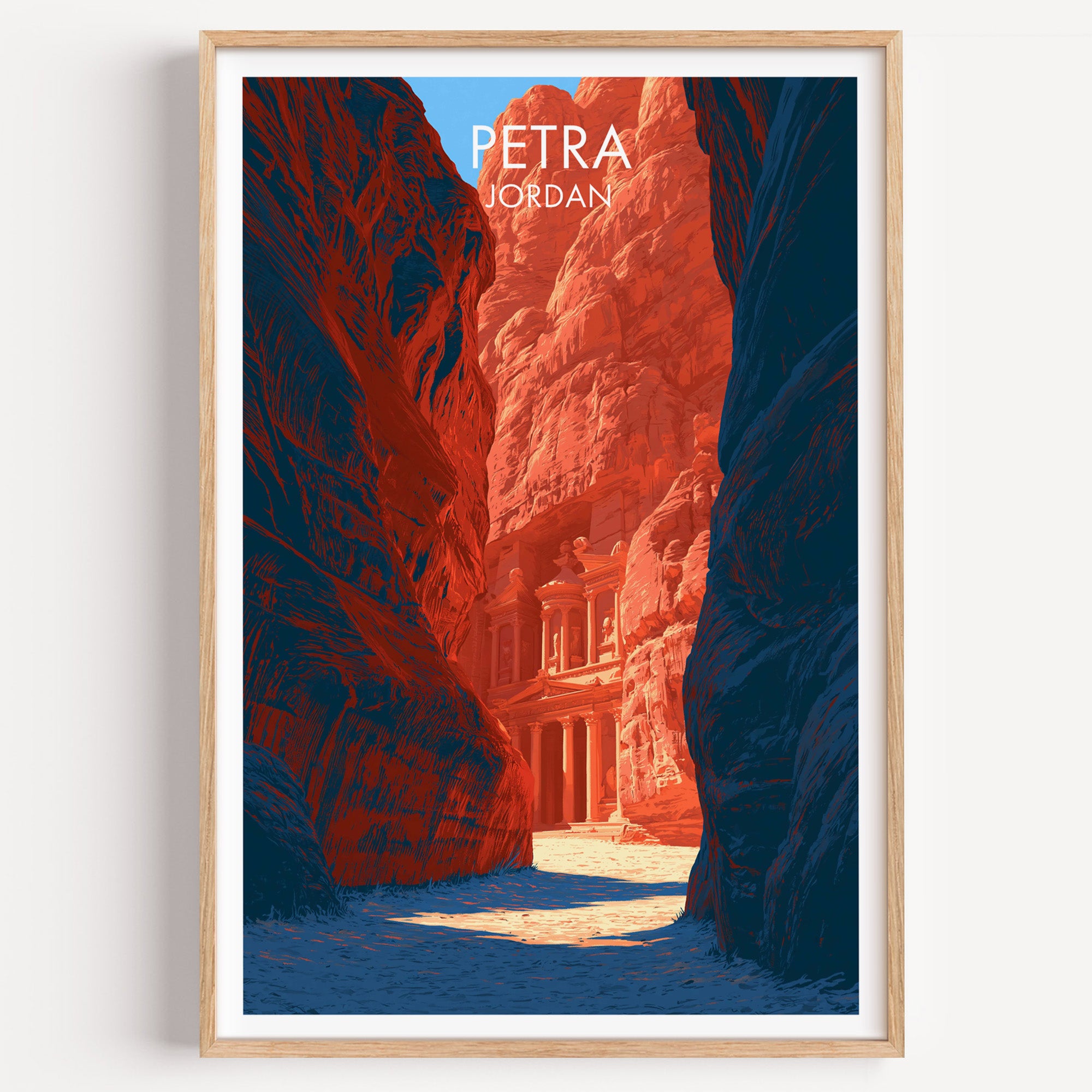 Petra Jordan Treasury travel poster in a natural wood frame, shown against a clean white wall