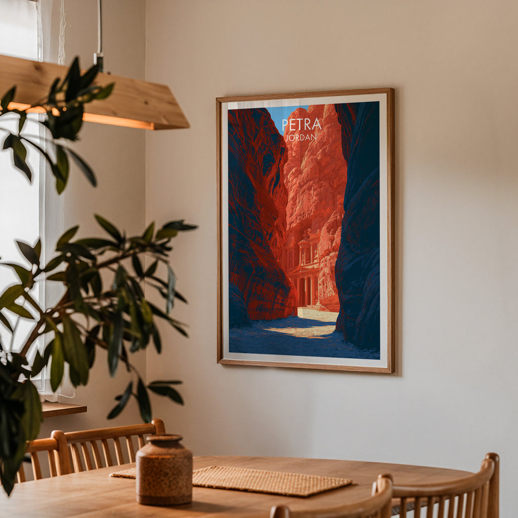 Framed Petra Jordan Treasury print on a dining room wall above an oak table in warm afternoon light