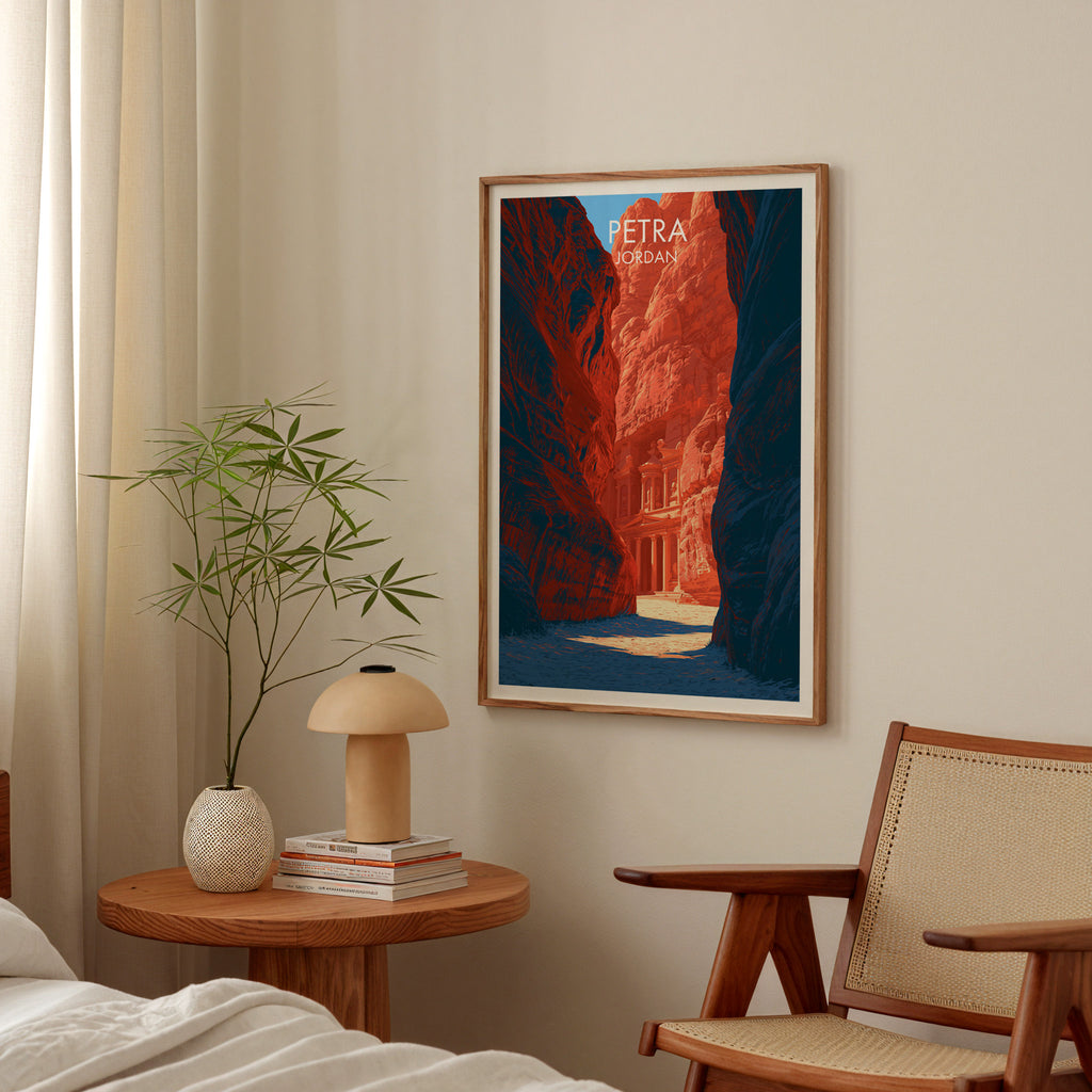 Petra Jordan Treasury poster above a bedroom nightstand with a bamboo plant and mushroom lamp