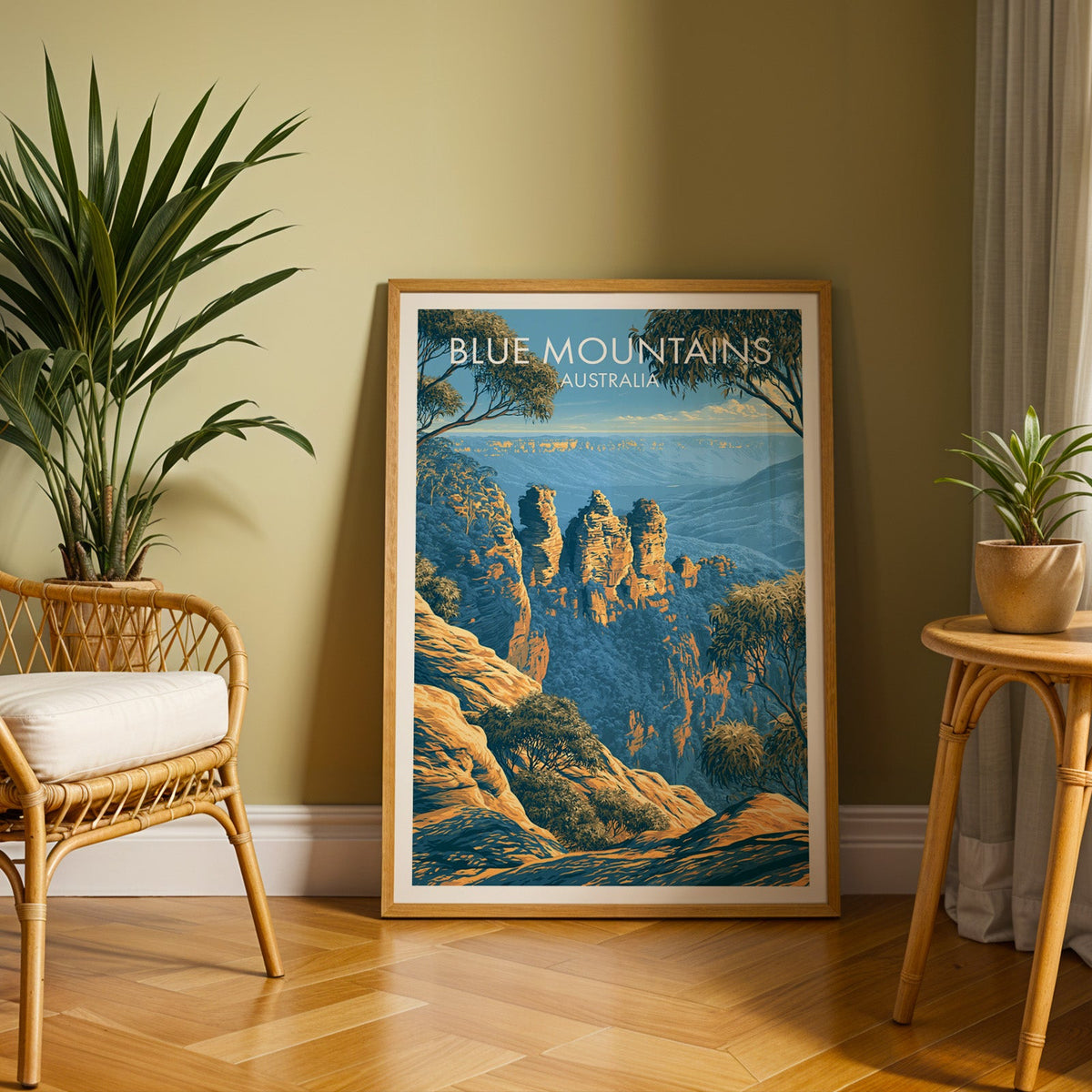 Golden cliff and blue valley print in an oak frame on herringbone parquet with a rattan chair