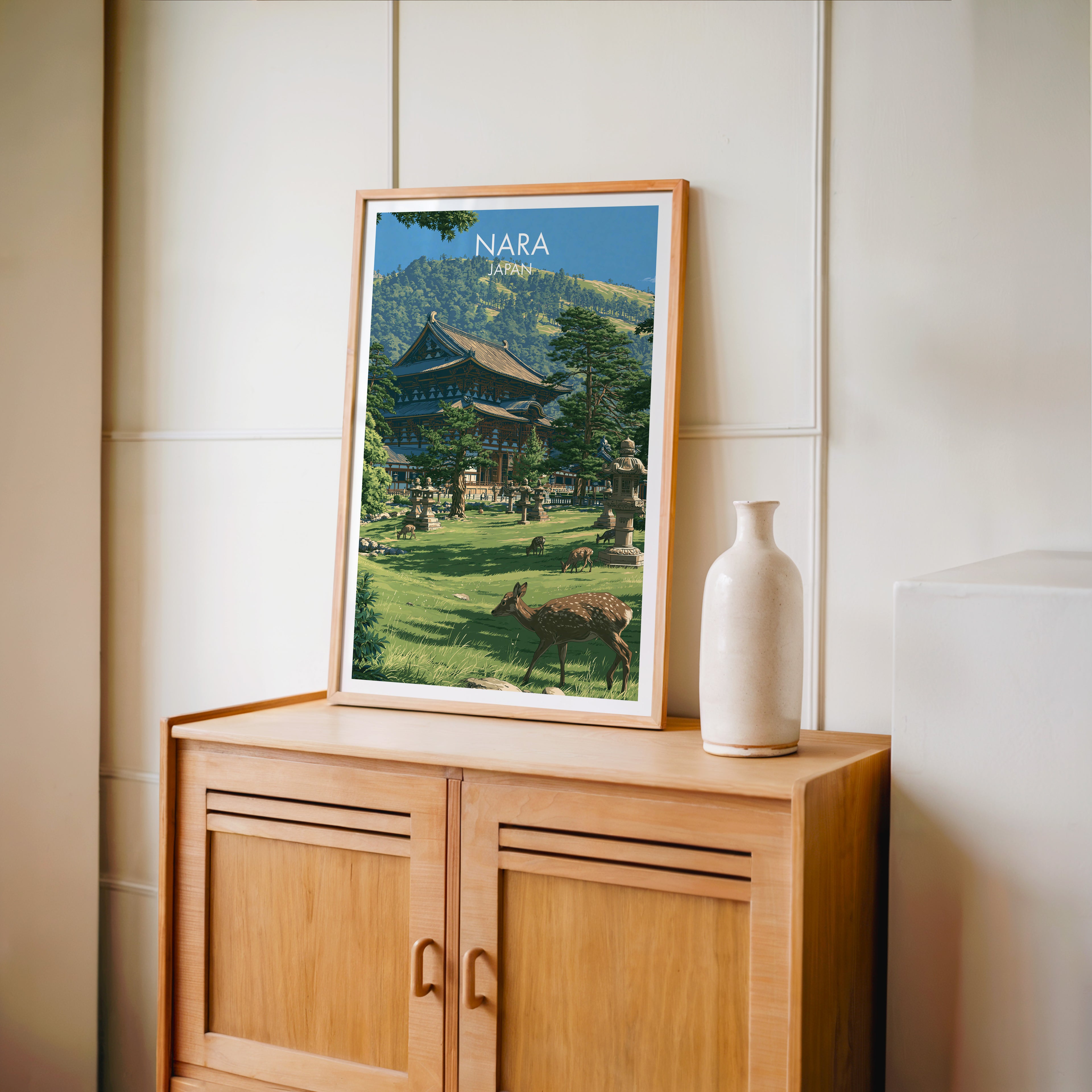 Small Todai ji Temple Nara Japan travel poster in an oak frame on a mid-century sideboard with a ceramic vase