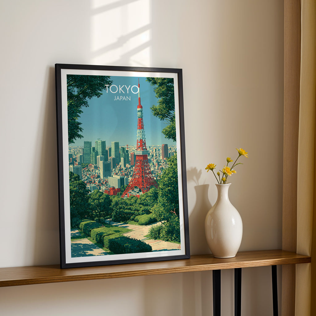 Black framed Tokyo Tower Japan print on a narrow hallway console in sunlight, styled with yellow flowers