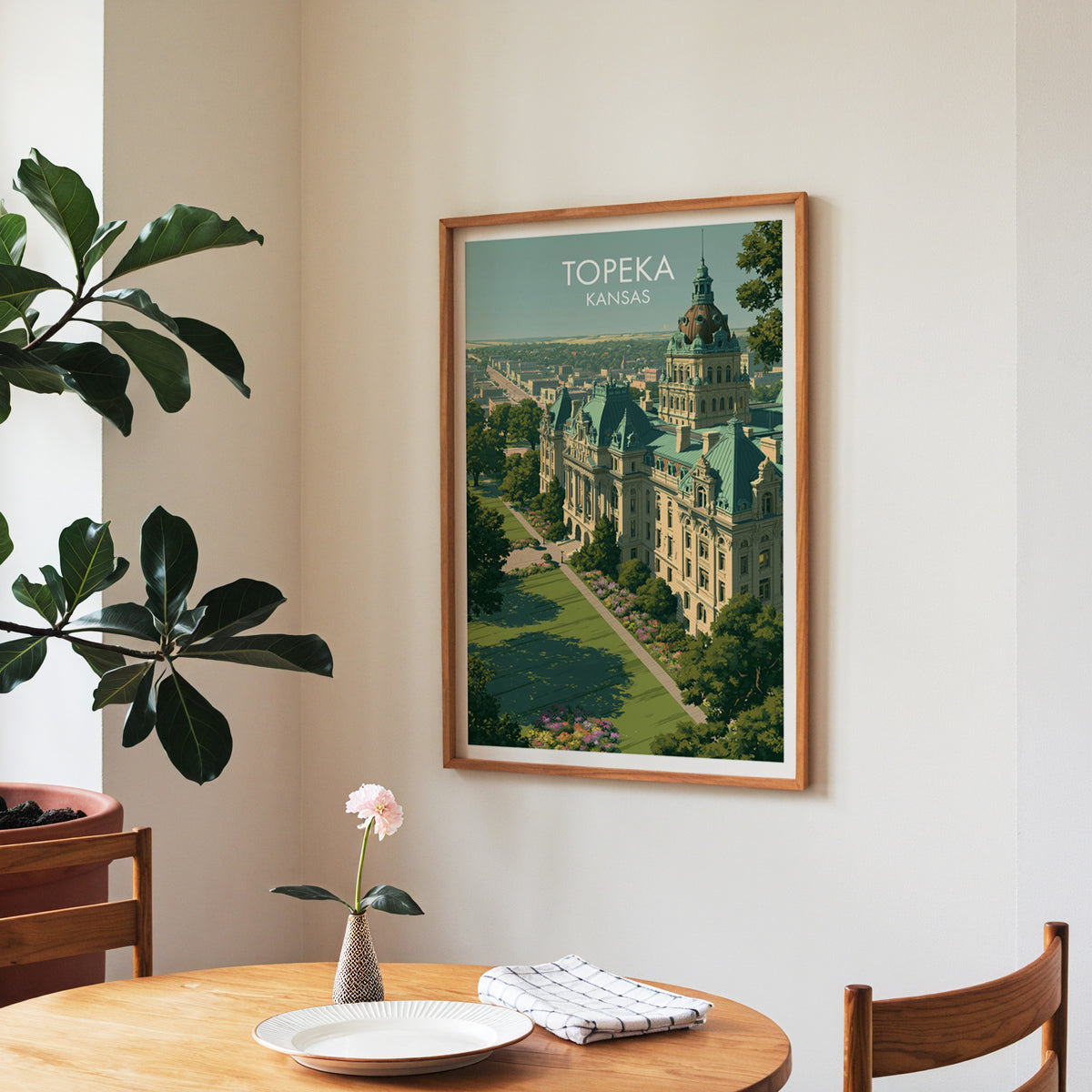 Copper dome and flowerbeds print in a walnut frame in a dining nook with round table, runner and roses.