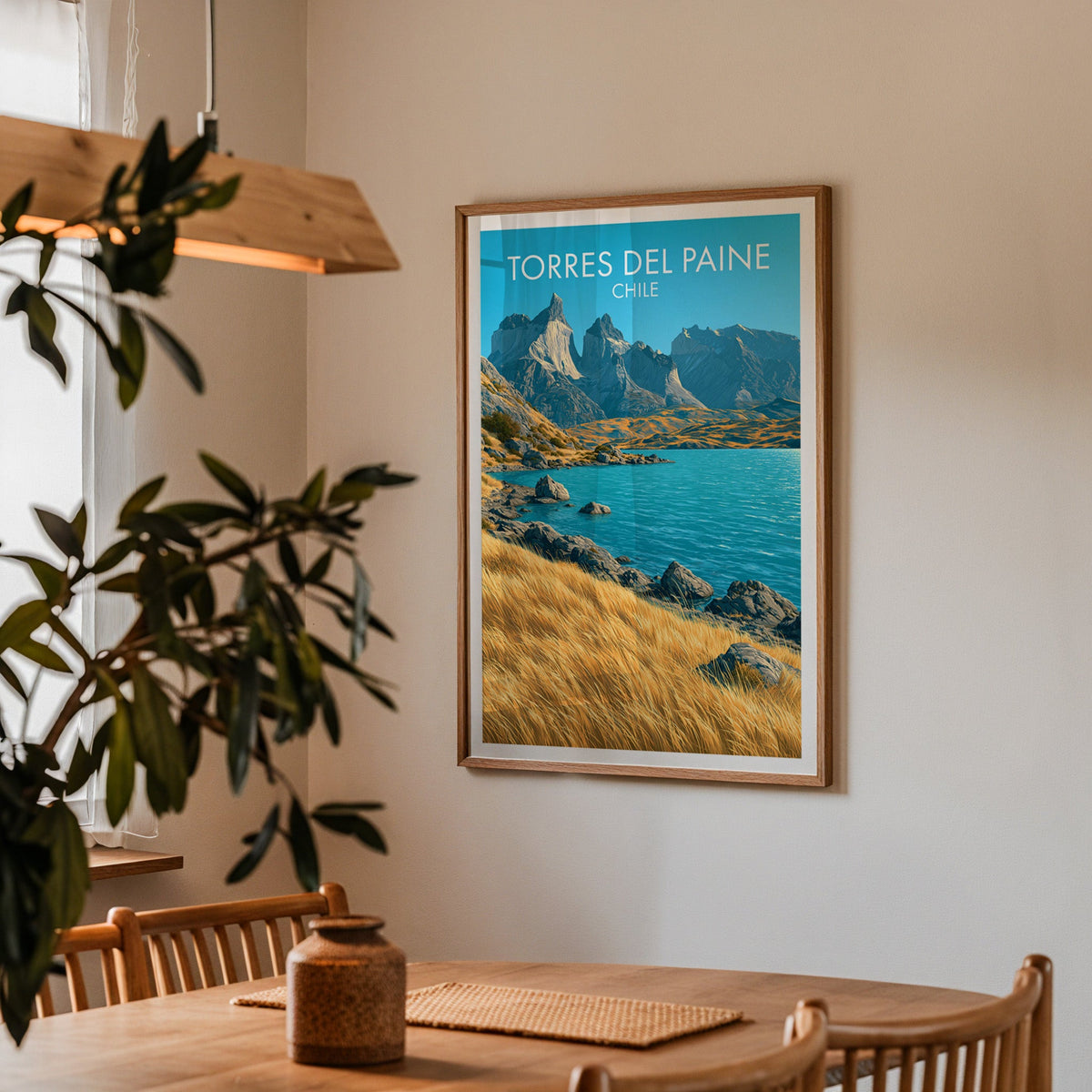 Granite spires print in an oak frame in a dining corner with a wood table, cane chairs and a wood pendant lamp