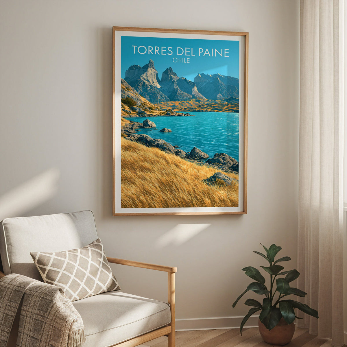 Turquoise lake wall art in an oak frame above a cream armchair with checked cushion, sheer curtains and a rubber plant